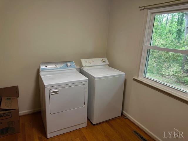116 Carson St, Brookneal, VA 24528 - laundry area featuring separate washer and dryer, light wood-style flooring, and plenty of natural light
