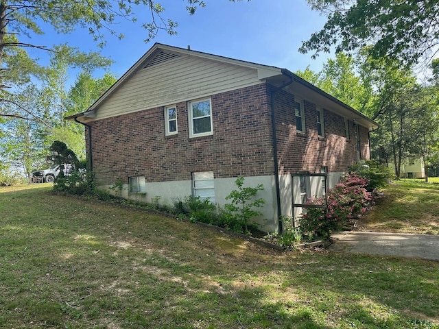 116 Carson St, Brookneal, VA 24528 - view of side of home featuring brick siding and a lawn