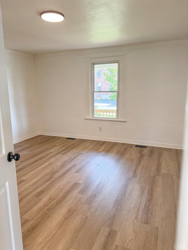 1305 Campbell Ave, Lynchburg, VA 24501 - spare room with wood finished floors and baseboards