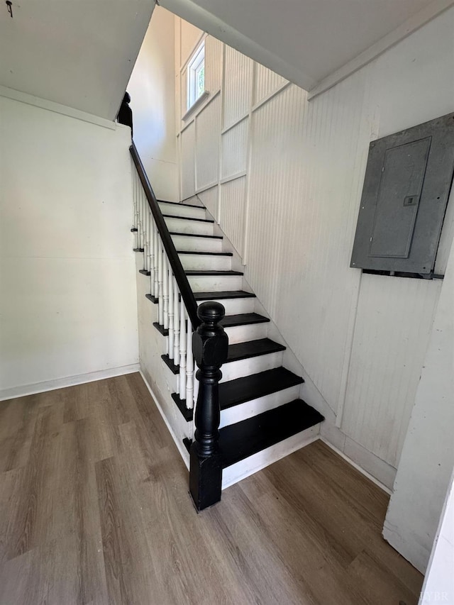 1305 Campbell Ave, Lynchburg, VA 24501 - staircase with electric panel, wood finished floors, and baseboards