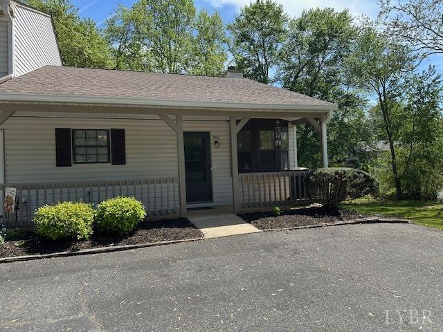 301 Gooseneck Ct, Forest, VA 24551 - view of front of home with a porch, a chimney, and roof with shingles