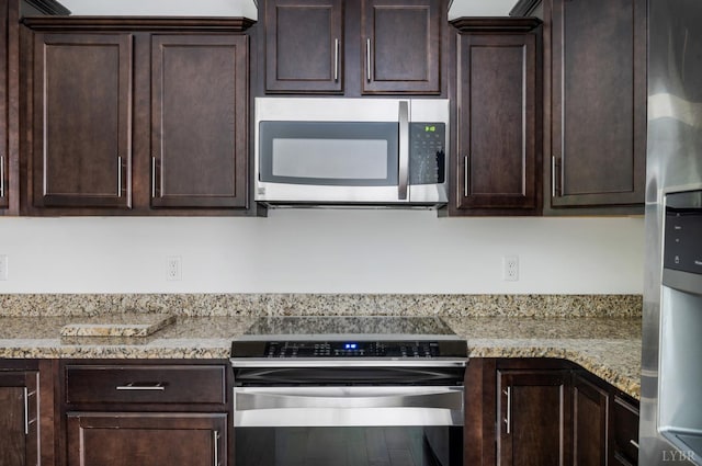 1057 Casley Way, Forest, VA 24551 - kitchen featuring appliances with stainless steel finishes, dark brown cabinetry, and light stone counters