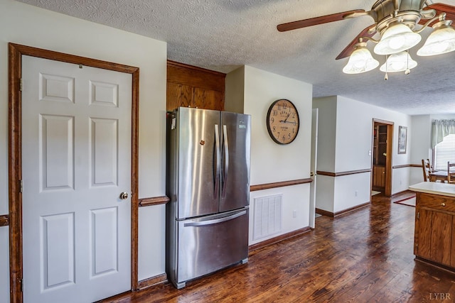 1529 Bateman Bridge Rd, Forest, VA 24551 - kitchen with freestanding refrigerator, dark wood-style flooring, visible vents, a ceiling fan, and a textured ceiling