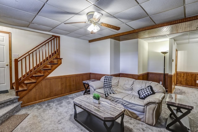 1529 Bateman Bridge Rd, Forest, VA 24551 - living area with carpet flooring, wood walls, stairway, a ceiling fan, and wainscoting