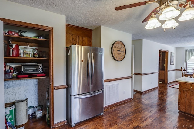 1529 Bateman Bridge Rd, Forest, VA 24551 - kitchen featuring dark wood-style floors, a textured ceiling, visible vents, and freestanding refrigerator
