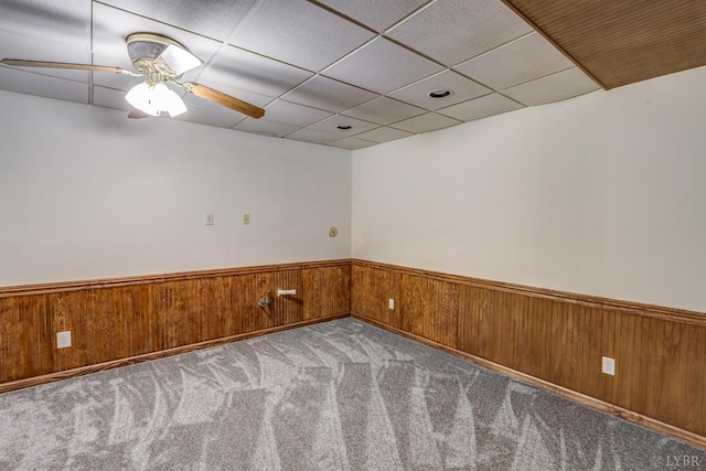 1529 Bateman Bridge Rd, Forest, VA 24551 - spare room featuring carpet flooring, a ceiling fan, wood walls, wainscoting, and a drop ceiling