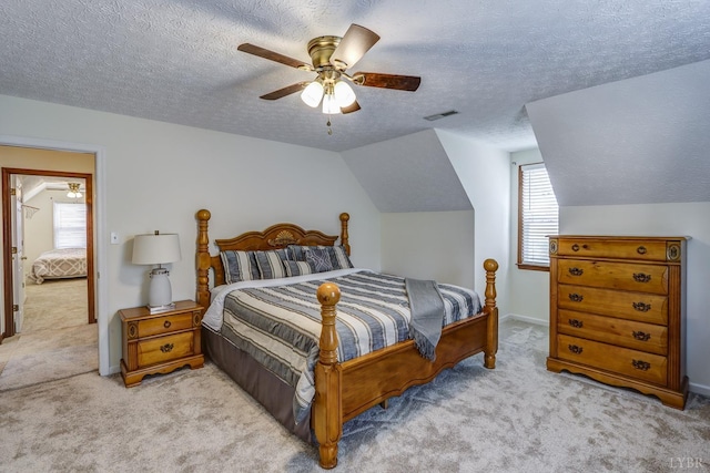 1529 Bateman Bridge Rd, Forest, VA 24551 - carpeted bedroom with ceiling fan, visible vents, vaulted ceiling, baseboards, and a textured ceiling