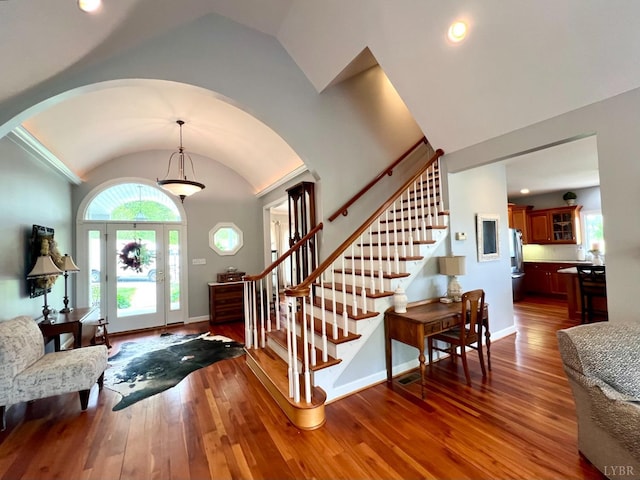 216 Burford Farm Rd, Monroe, VA 24574 - entryway with arched walkways, vaulted ceiling, stairway, and wood finished floors