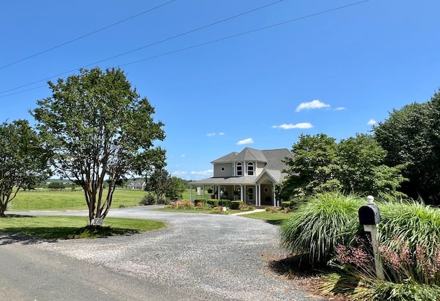 216 Burford Farm Rd, Monroe, VA 24574 - view of front facade featuring a front lawn, curved driveway, and a porch