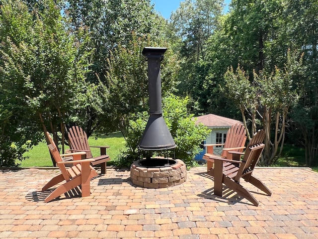 216 Burford Farm Rd, Monroe, VA 24574 - view of patio with an outdoor fire pit and an outbuilding