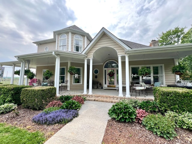 216 Burford Farm Rd, Monroe, VA 24574 - view of front of house featuring a porch and a chimney
