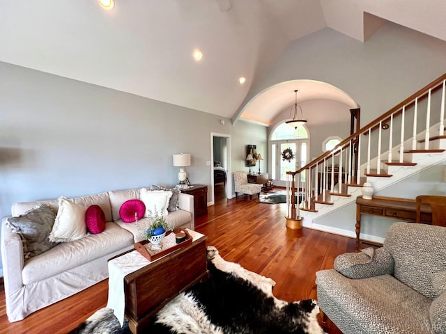 216 Burford Farm Rd, Monroe, VA 24574 - living area with arched walkways, stairway, wood finished floors, recessed lighting, and high vaulted ceiling