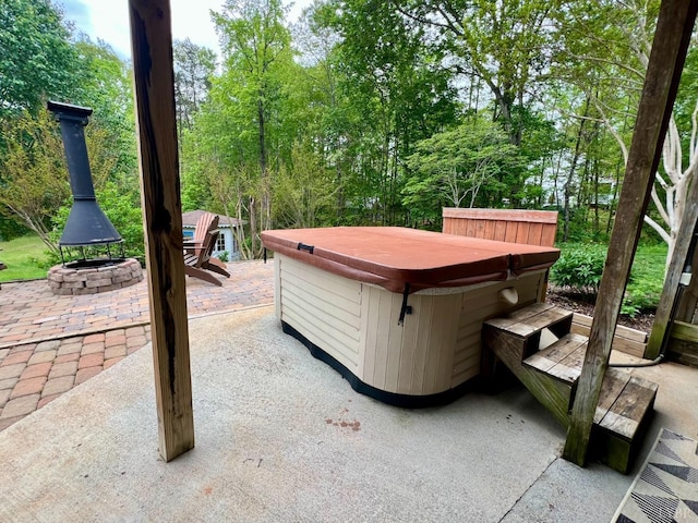 216 Burford Farm Rd, Monroe, VA 24574 - view of patio / terrace featuring a hot tub and an outdoor fire pit