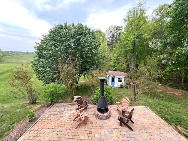 216 Burford Farm Rd, Monroe, VA 24574 - view of patio / terrace with an outdoor structure and a fire pit