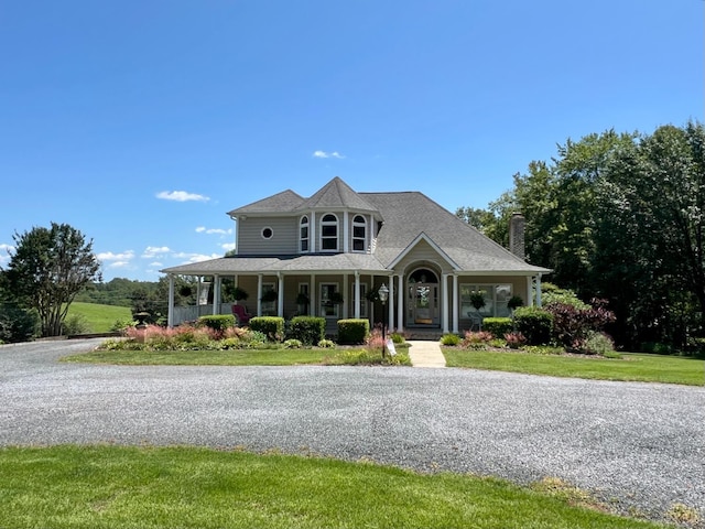 216 Burford Farm Rd, Monroe, VA 24574 - victorian house featuring a porch, a front yard, and a chimney