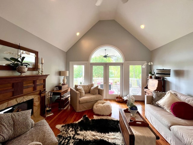 216 Burford Farm Rd, Monroe, VA 24574 - living area with high vaulted ceiling, wood finished floors, a fireplace, a ceiling fan, and recessed lighting