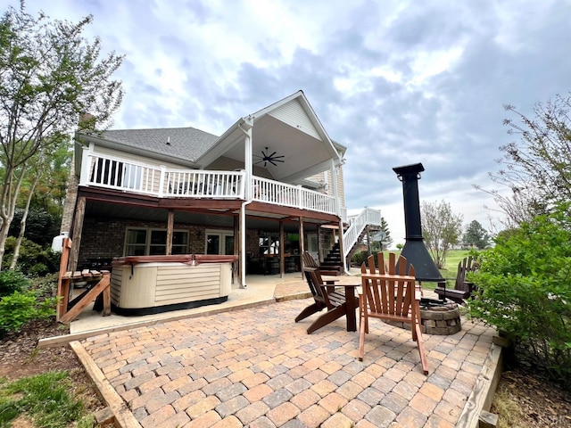 216 Burford Farm Rd, Monroe, VA 24574 - rear view of property featuring a hot tub, a fire pit, stairs, a patio, and ceiling fan