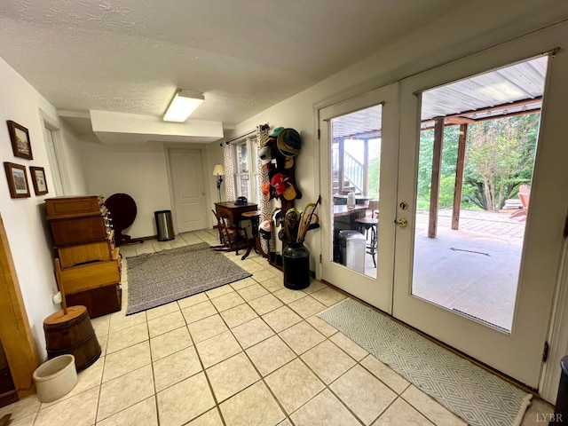 216 Burford Farm Rd, Monroe, VA 24574 - entryway with light tile patterned floors, a textured ceiling, and french doors