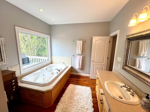 216 Burford Farm Rd, Monroe, VA 24574 - full bathroom with a whirlpool tub, vanity, wood finished floors, and recessed lighting
