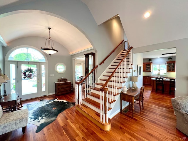 216 Burford Farm Rd, Monroe, VA 24574 - entryway featuring lofted ceiling, arched walkways, stairway, hardwood / wood-style floors, and healthy amount of natural light