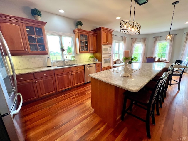 216 Burford Farm Rd, Monroe, VA 24574 - kitchen with stainless steel appliances, a breakfast bar, wood-type flooring, a kitchen island, and recessed lighting