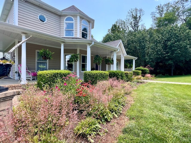 216 Burford Farm Rd, Monroe, VA 24574 - view of home's exterior featuring a porch and a lawn