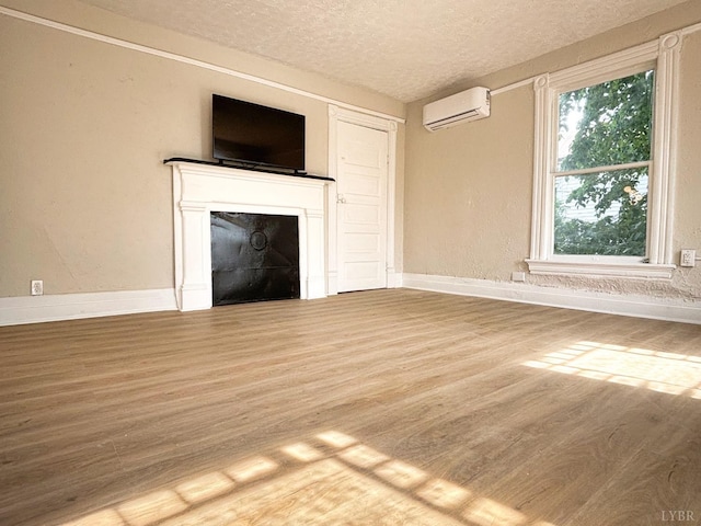 850 Rivermont Ave, Lynchburg, VA 24504 - unfurnished living room with a wall mounted air conditioner, wood finished floors, a textured ceiling, baseboards, and a fireplace