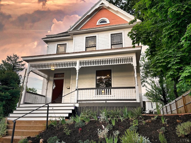 850 Rivermont Ave, Lynchburg, VA 24504 - victorian house with covered porch, fence, and stairway