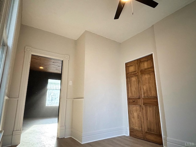 850 Rivermont Ave, Lynchburg, VA 24504 - unfurnished bedroom featuring wood finished floors, a ceiling fan, and baseboards