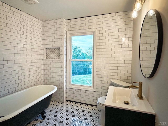 850 Rivermont Ave, Lynchburg, VA 24504 - bathroom with tile walls, a freestanding tub, toilet, and vanity