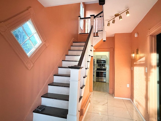 850 Rivermont Ave, Lynchburg, VA 24504 - stairway featuring marble finish floors, baseboards, and track lighting
