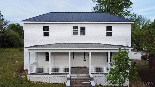 607 N St, Bedford, VA 24523 - view of front facade featuring covered porch, metal roof, and a front lawn