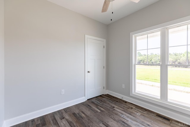 243 Pebble Rd, Rustburg, VA 24588 - empty room with healthy amount of natural light, dark wood finished floors, a ceiling fan, and baseboards