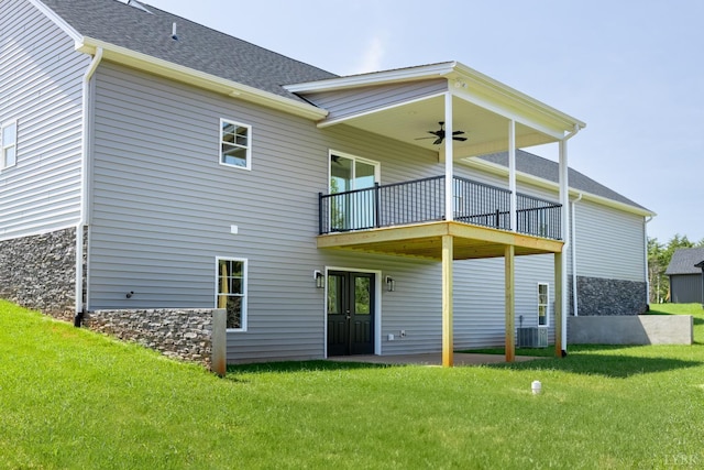 243 Pebble Rd, Rustburg, VA 24588 - back of property with a lawn, a balcony, a ceiling fan, a shingled roof, and stone siding