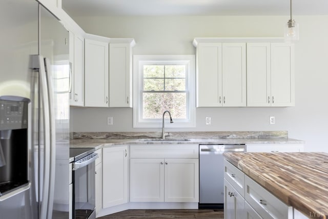 243 Pebble Rd, Rustburg, VA 24588 - kitchen with stainless steel appliances, a sink, white cabinets, and light stone countertops