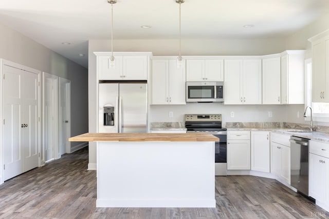 243 Pebble Rd, Rustburg, VA 24588 - kitchen with appliances with stainless steel finishes, a sink, wood counters, a kitchen island, and white cabinetry
