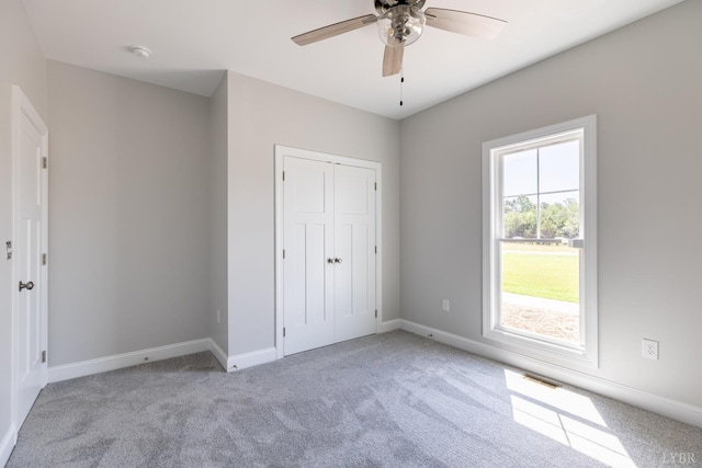 243 Pebble Rd, Rustburg, VA 24588 - unfurnished bedroom featuring carpet, baseboards, a closet, and a ceiling fan