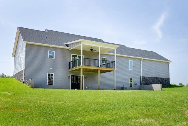243 Pebble Rd, Rustburg, VA 24588 - rear view of house featuring a yard, ceiling fan, a shingled roof, and a balcony