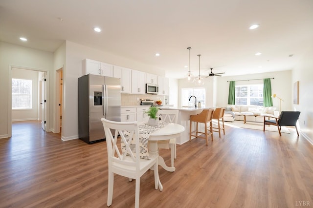 128 Brenleigh Ct Unit 108, Lynchburg, VA 24501 - dining area with recessed lighting, light wood finished floors, a ceiling fan, and baseboards