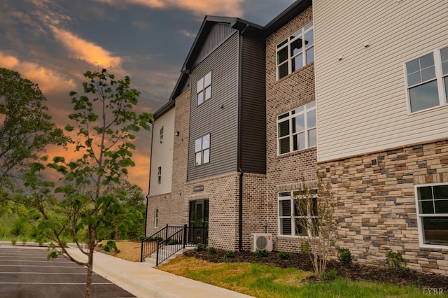 128 Brenleigh Ct Unit 108, Lynchburg, VA 24501 - view of building exterior featuring ac unit and uncovered parking