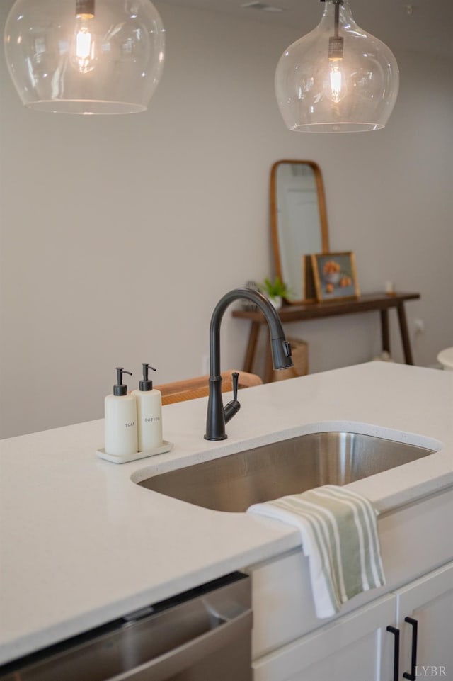 128 Brenleigh Ct Unit 108, Lynchburg, VA 24501 - detailed view of a sink, dishwasher, light countertops, and white cabinetry