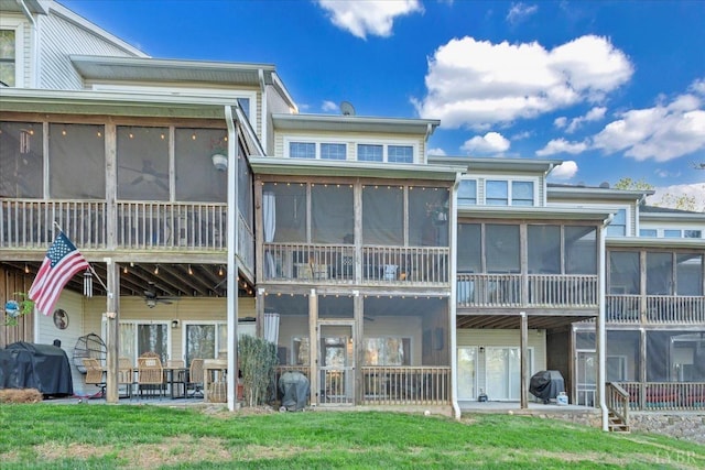 231 Mountain Cove Dr Unit 5, Hardy, VA 24101 - back of house featuring a sunroom, a patio area, and a lawn