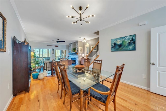 231 Mountain Cove Dr Unit 5, Hardy, VA 24101 - dining space featuring ornamental molding, light wood-style flooring, a chandelier, ceiling fan, and stairway