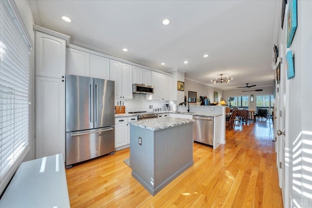 231 Mountain Cove Dr Unit 5, Hardy, VA 24101 - kitchen with appliances with stainless steel finishes, a peninsula, white cabinetry, light wood-style floors, and recessed lighting