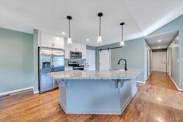 1400 Mountain Cut Rd, Appomattox, VA 24522 - kitchen with stainless steel appliances, white cabinets, a sink, and a kitchen bar