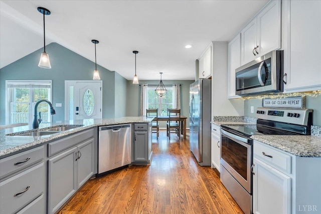 1400 Mountain Cut Rd, Appomattox, VA 24522 - kitchen with a sink, lofted ceiling, stainless steel appliances, wood finished floors, and decorative light fixtures