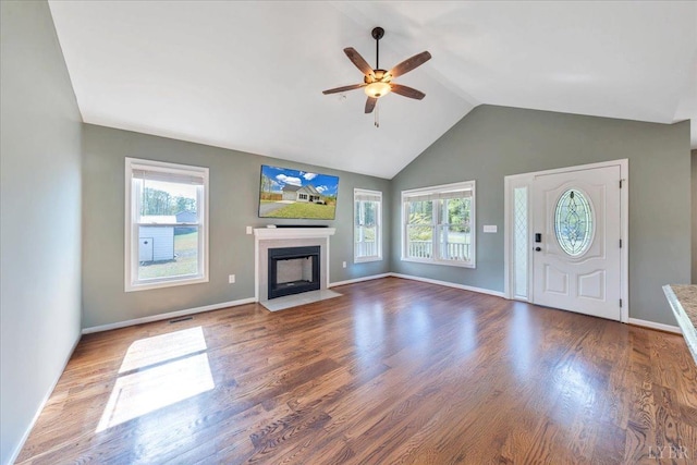 1400 Mountain Cut Rd, Appomattox, VA 24522 - unfurnished living room featuring a ceiling fan, baseboards, high vaulted ceiling, a fireplace with flush hearth, and wood finished floors