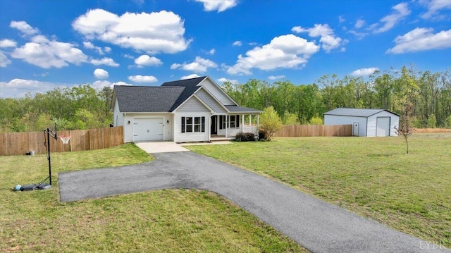 1400 Mountain Cut Rd, Appomattox, VA 24522 - view of front of home featuring fence, covered porch, a front yard, aphalt driveway, and a storage unit