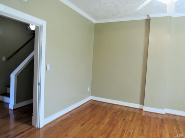 1697 S Amherst Hwy, Amherst, VA 24521 - spare room with crown molding, light wood-style flooring, ceiling fan, baseboards, and stairway