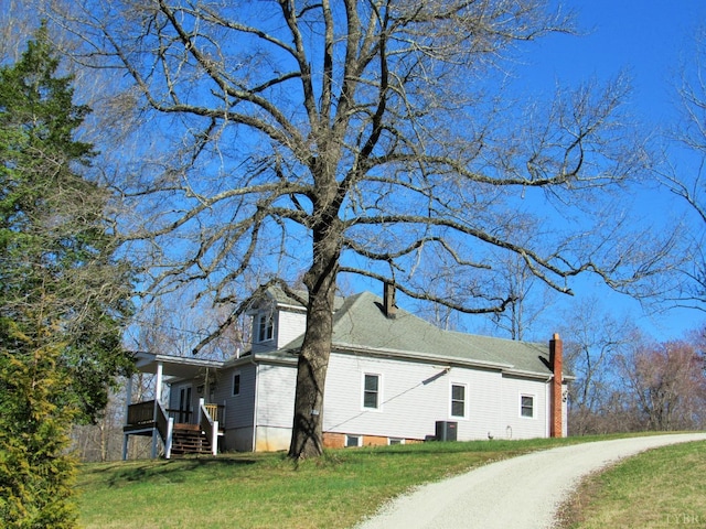 1697 S Amherst Hwy, Amherst, VA 24521 - view of side of home with a chimney, a yard, and central AC
